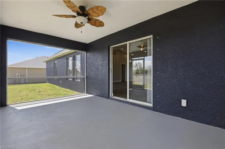View of patio featuring a ceiling fan