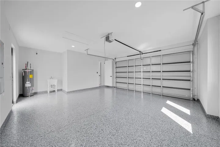 Garage with recessed lighting and electric water heater