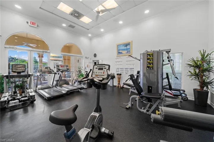 The property features a well-equipped fitness center with various exercise machines, including treadmills and stationary bikes