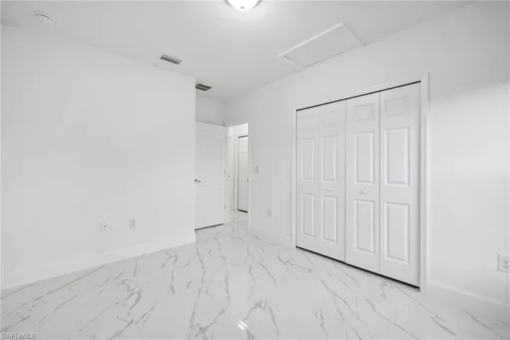 Unfurnished bedroom with a closet