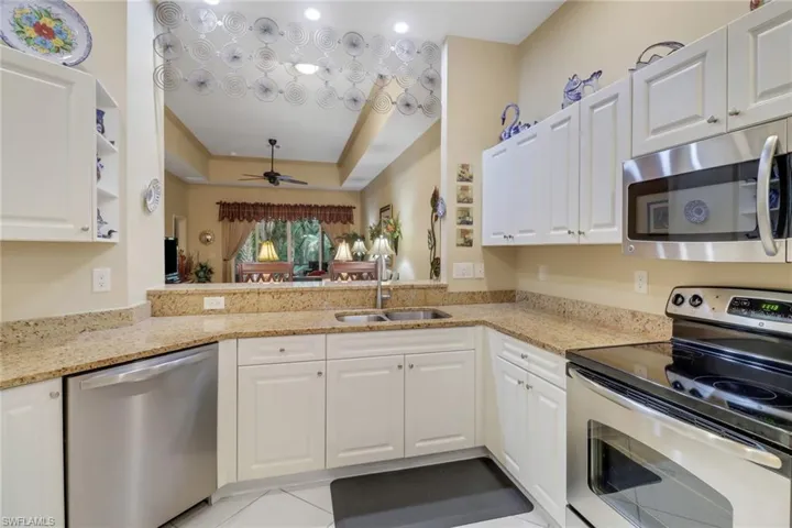 this kitchen has lots of storage and also offers a full pantry.