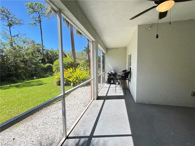 Unfurnished sunroom with a ceiling fan