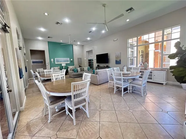 Dining room featuring recessed lighting, a ceiling fan, and light tile patterned floors
