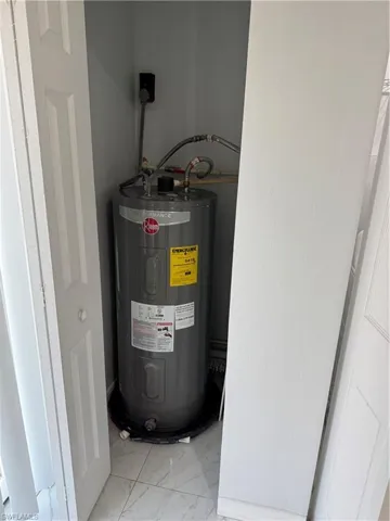 Utility room with electric water heater