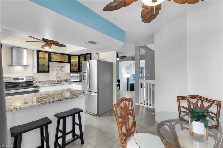 KITCHEN, BREAKFAST BAR, DINING AREA