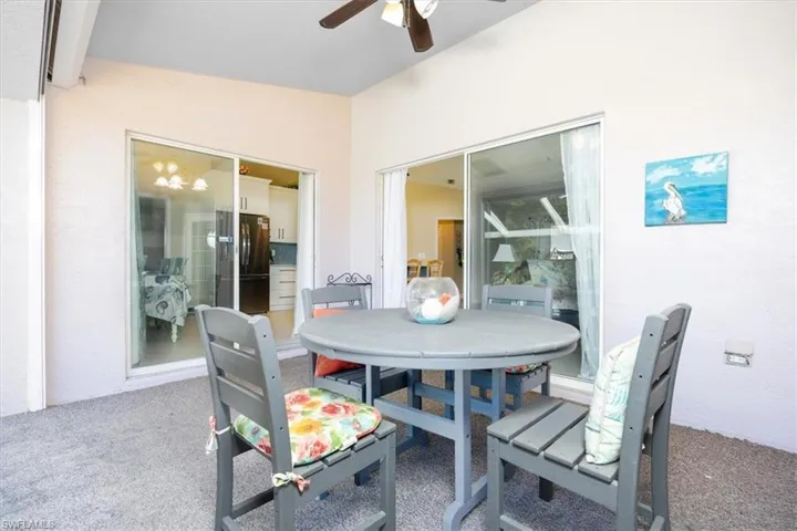 View of patio / terrace featuring outdoor dining area and ceiling fan