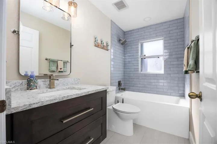 Full bath with vanity and shower / bathtub combination