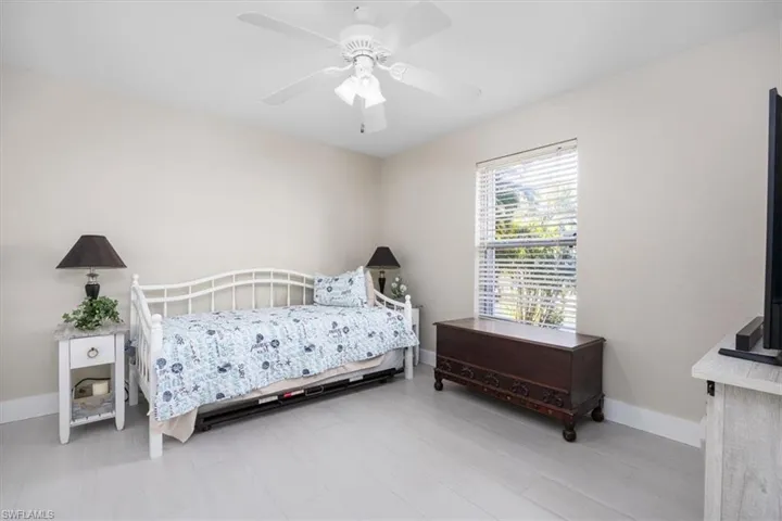 Bedroom featuring baseboards and a ceiling fan