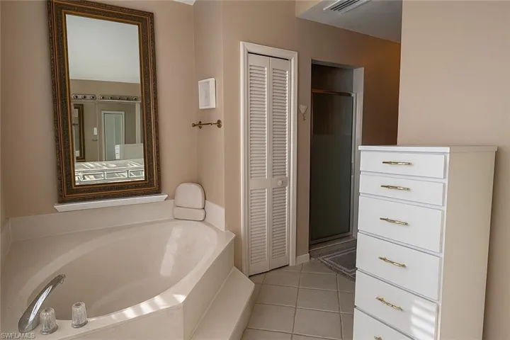 Primary bath featuring 2 closets