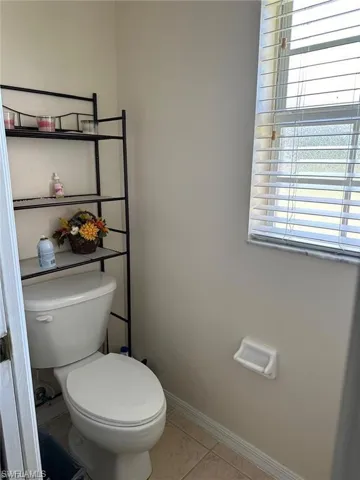 Bathroom featuring tile patterned floors and toilet