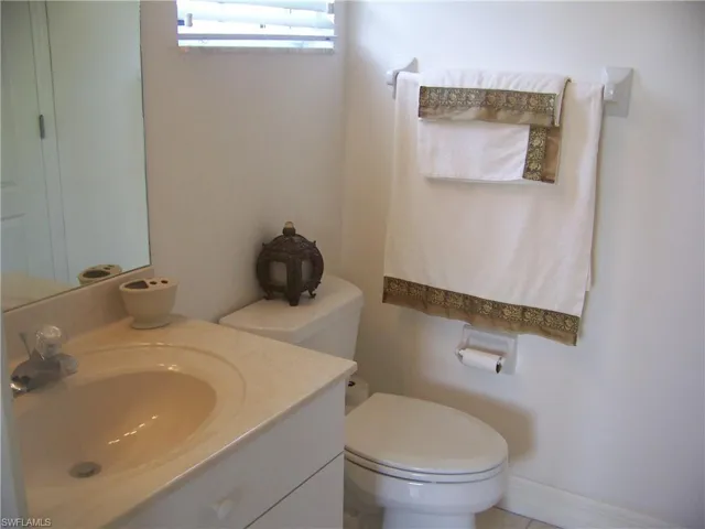 Bathroom featuring toilet and vanity for Guest room #1