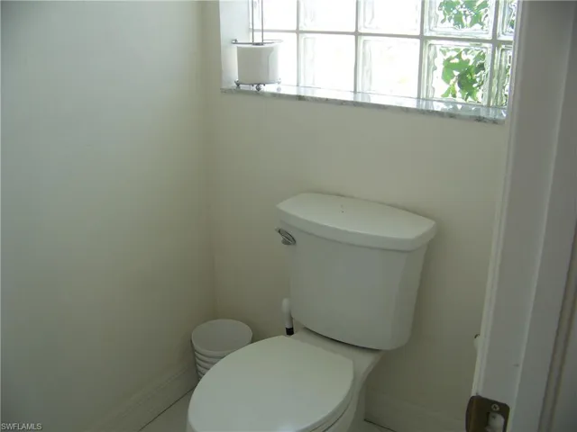 Separate "water closet" with glass block accents in master bath. This is a very LARGE bathroom!