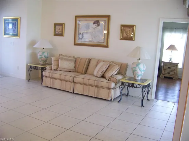View of tiled living room with Master entrance to the right