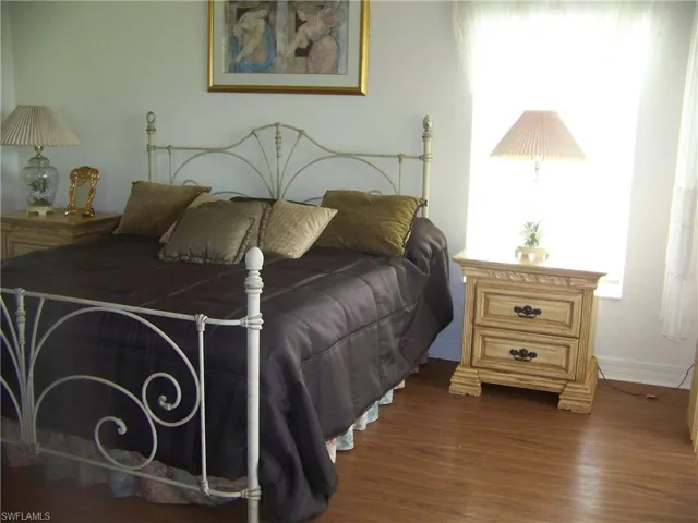 Master bedroom with composite wood-style floors