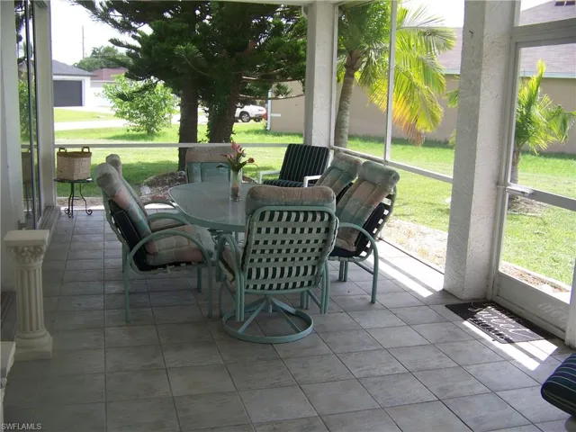 Tiles, screened lanai in rear of home with views of golf course.