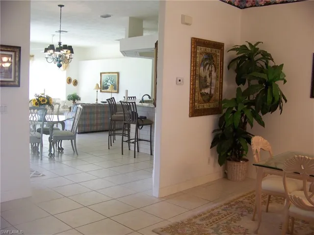 Great room/dining with view of dinette, kitchen and family room.