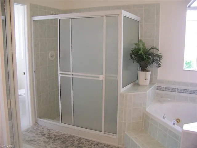 Master bath free standing shower all tiled.