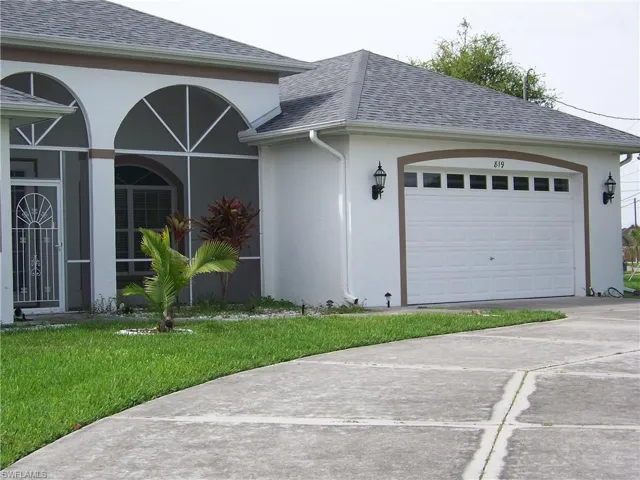 Right front side of this beauty offering a circular driveway and 2+ car garage.