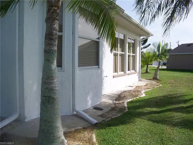 View of home's exterior with lots of downspouts/gutters