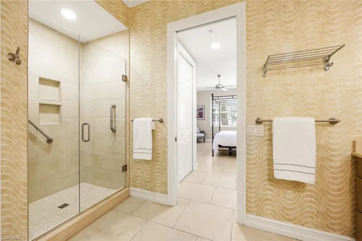 Walk-In Tiled Shower with Multiple Shower Heads in Owner's Suite