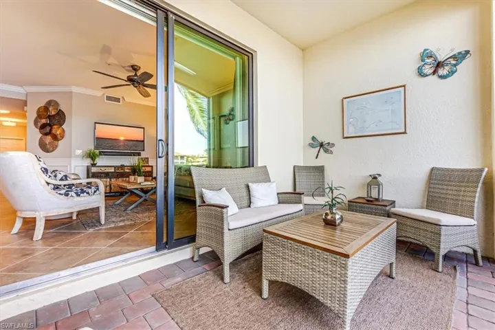 Screened in furnished lanai with lake view