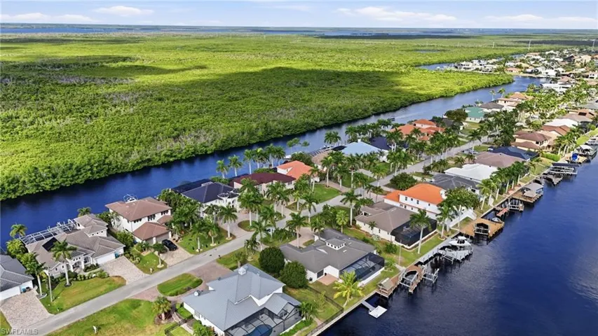 Aerial perspective of suburban area with a nearby body of water