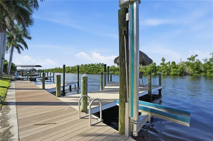 Dock area featuring a water view