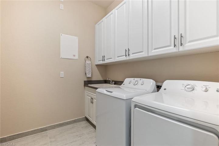 Laundry room with storage area