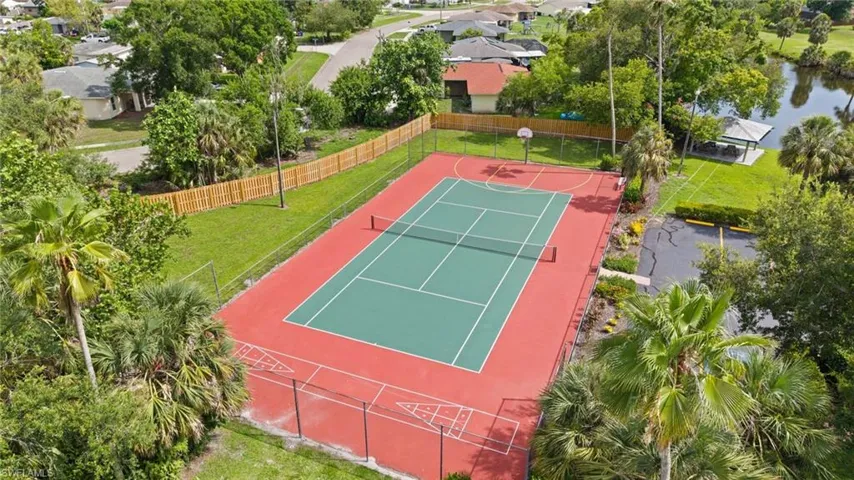 Tennis / Basketball Court w/ View of pond