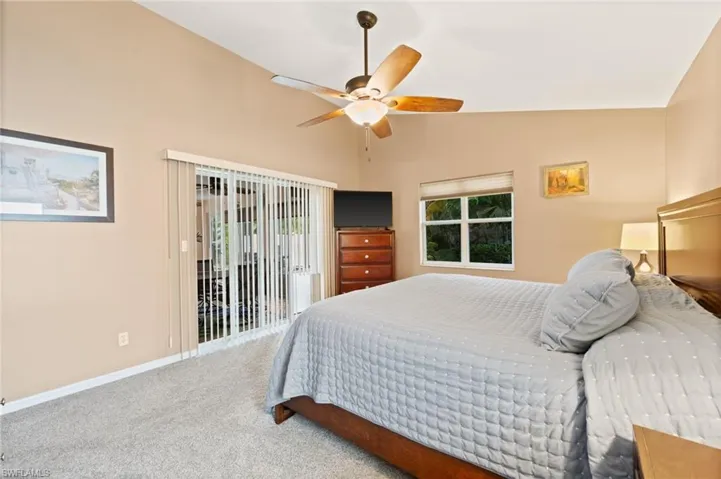 Primary Bedroom w/ Sliders to Florida Room