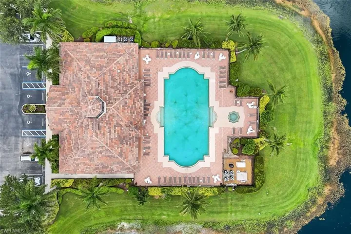 Aerial view of a pool and a local golf course