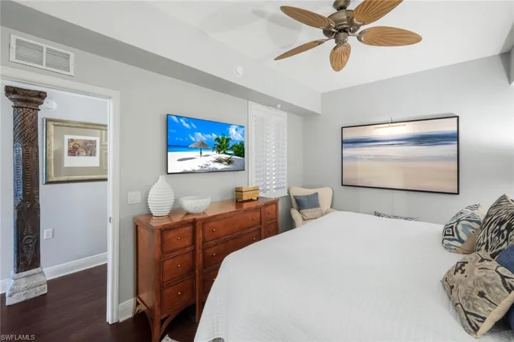 Bedroom with wood finished floors and a ceiling fan