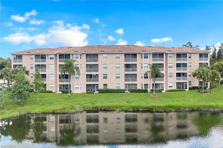 View of apartment building / complex with a water view