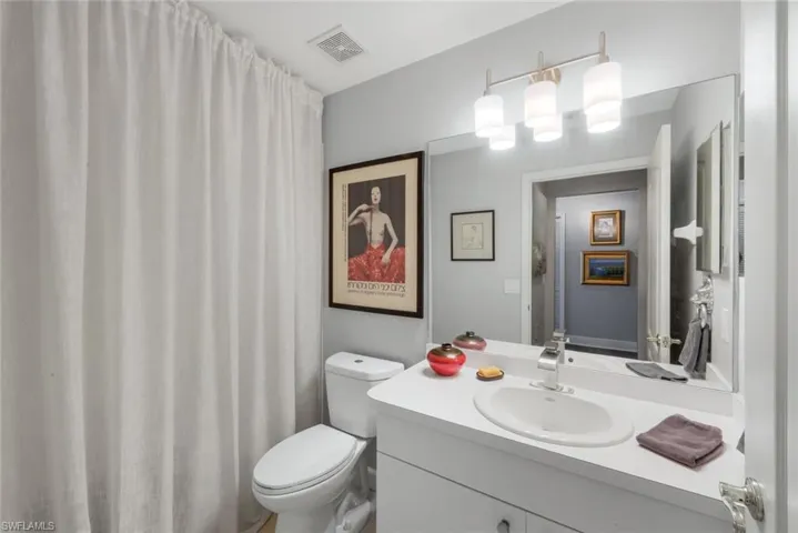Full bath with vanity and curtained shower