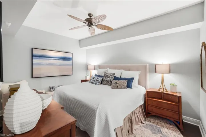 Bedroom featuring a ceiling fan and baseboards