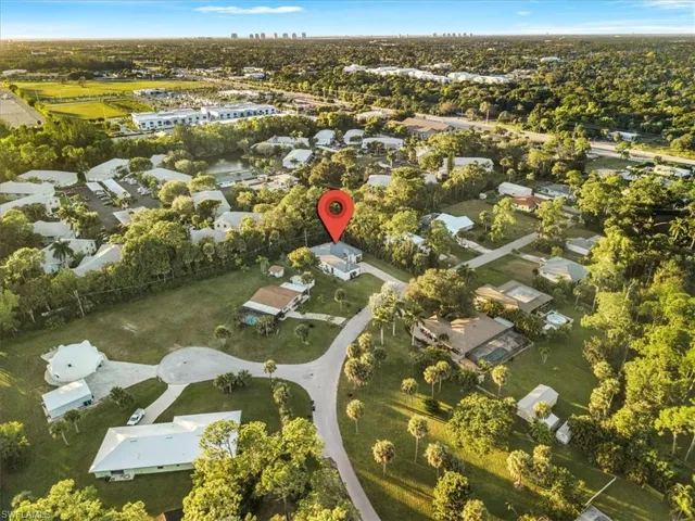 Aerial overview of property's location with nearby suburban area