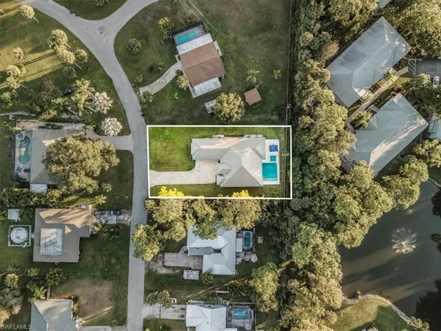 Aerial overview of property's location featuring property boundaries highlighted and nearby suburban area