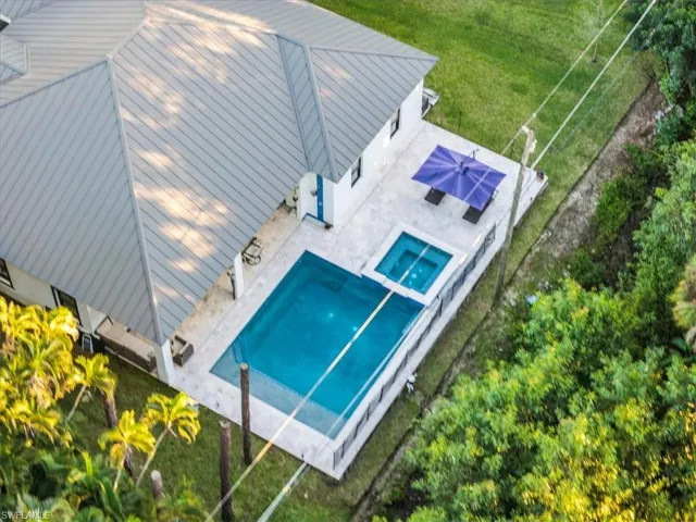 View from above of property featuring a pool