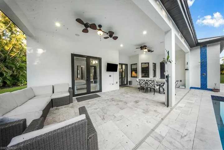View of patio / terrace with ceiling fan, an outdoor hangout area, outdoor dining space, and french doors