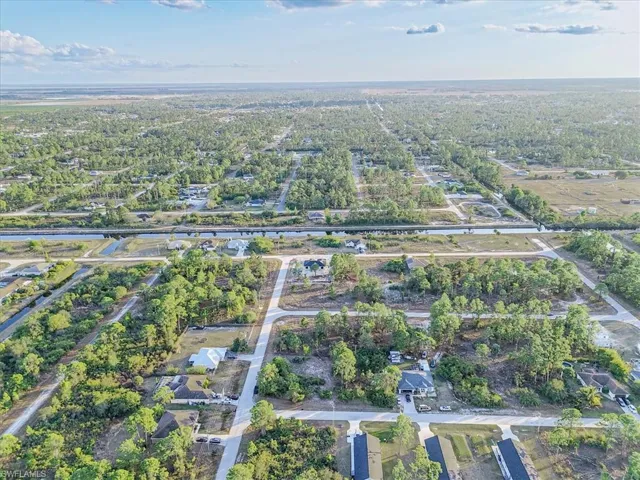 Aerial overview of property's location featuring nearby suburban area