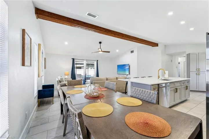 Dining space featuring ceiling fan, light tile patterned floors, recessed lighting, and baseboards