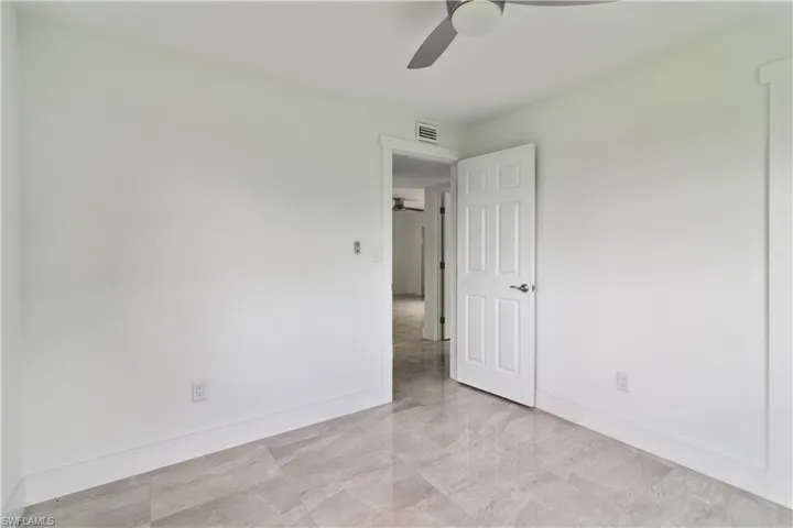 Empty room featuring ceiling fan