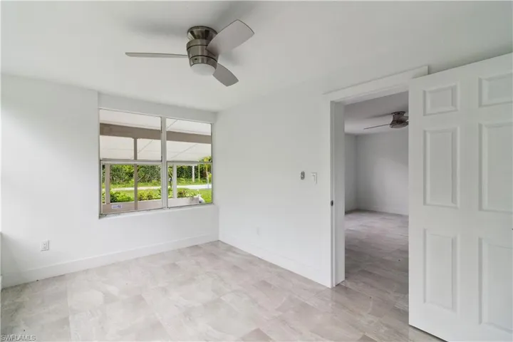 Spare room with ceiling fan