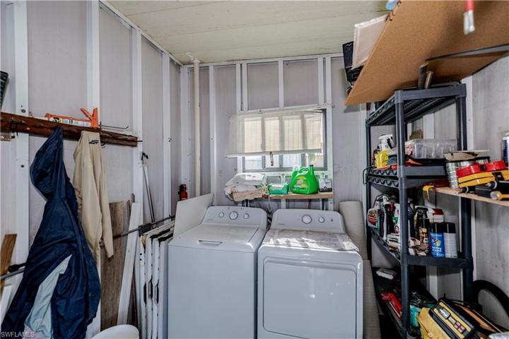 Laundry room in storage room just outside of home