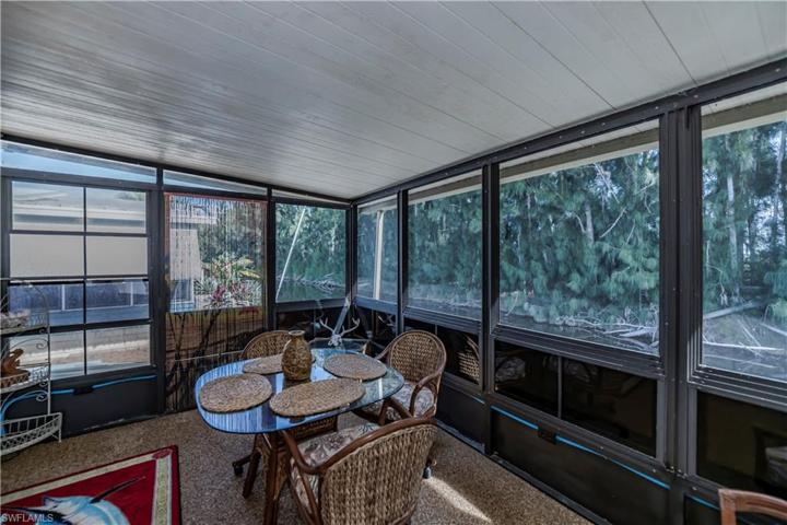 screened in as well outside there is a back porch area