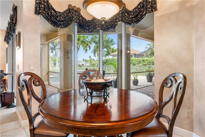 Cozy breakfast nook with awe inspiring views of the pool and lake!