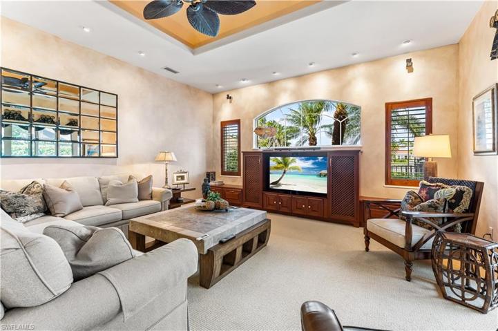 Views of the lake from this 2nd living space. Arched custom window above T.V. Tray ceiling!
