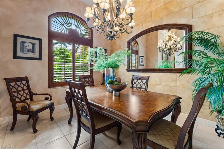 Beautful formal dinign space with custom wood plantation shutters! Lots of natural light spills into this home!