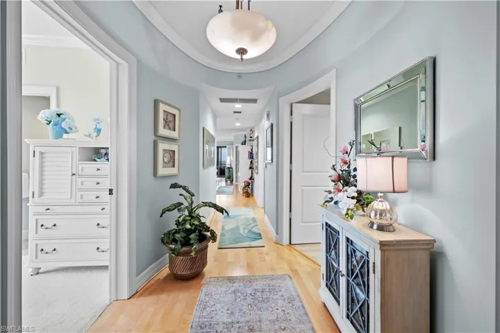 Corridor featuring wood finished floors and baseboards