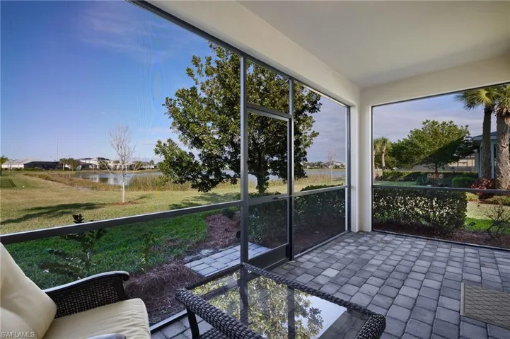 Unfurnished sunroom featuring a water view